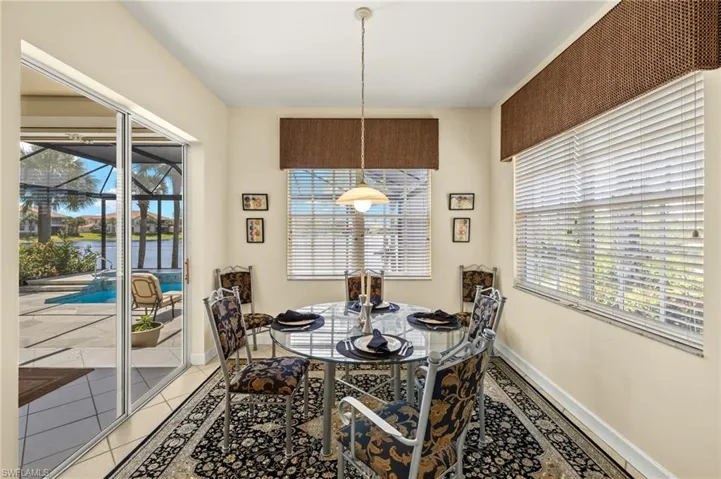 Dining room featuring baseboards, a wealth of natural light, and light tile patterned floors