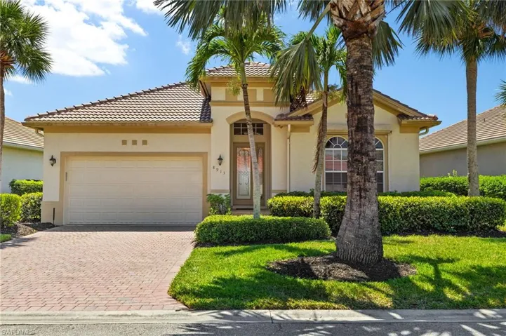 Mediterranean / spanish home featuring stucco siding, an attached garage, decorative driveway, and a tiled roof