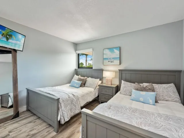 Bedroom featuring light wood-style flooring and a textured ceiling