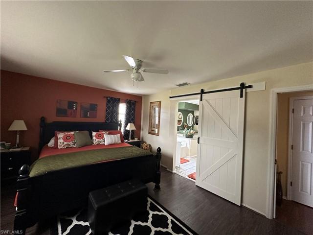 Barn Door Enhances the Master Bathroom Entry