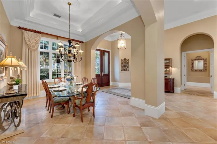 High ceiling and generous crown moldings make this dining room the perfect place for those holiday, family dinners!