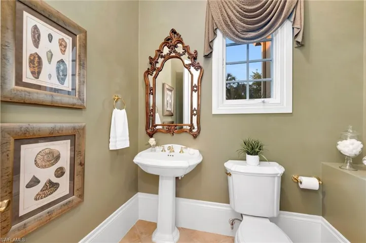 Powder room that is located next to the office, which can easily be made into a 4th bath.