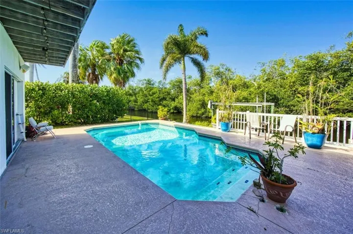 View of pool featuring a fenced in pool and a patio