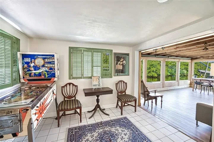 Sitting room with tile patterned flooring and baseboards