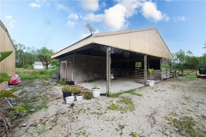 Horse barn with covered wash rack, tack room and attached turnout