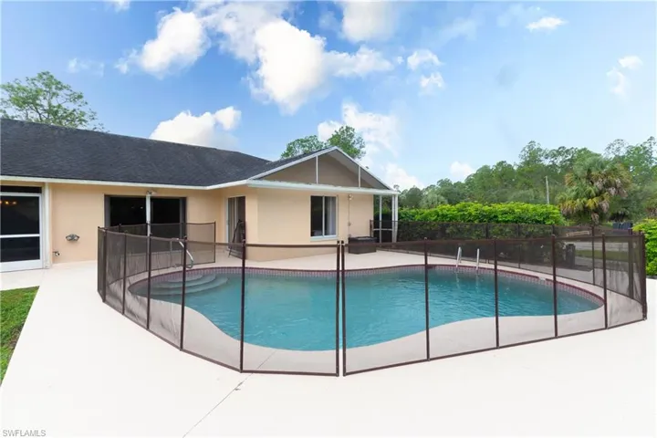 Salt Water Pool with open deck and safety fence