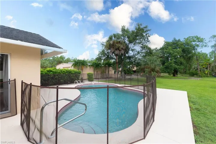 Salt Water Pool with open deck and safety fence