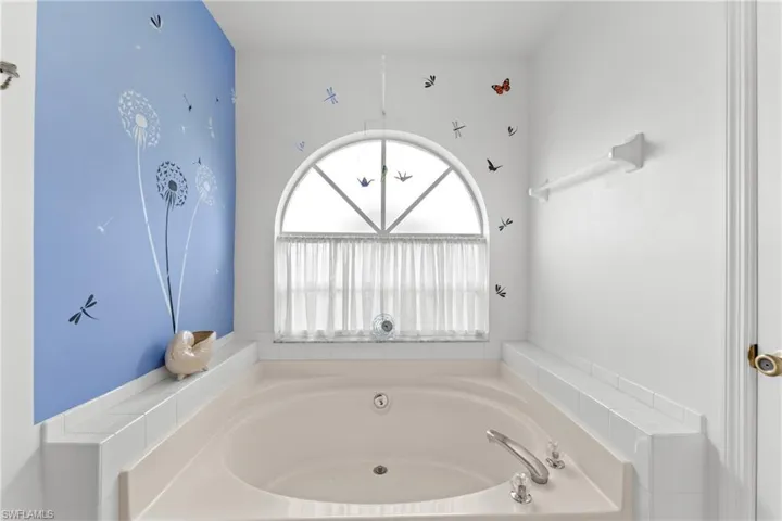 Full bathroom with a bath