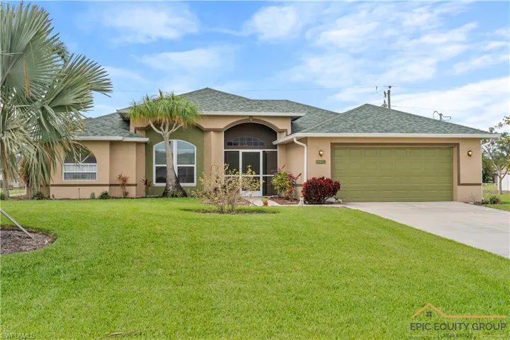 Ranch-style house featuring stucco siding, a shingled roof, an attached garage, driveway, and a front yard