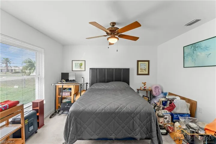 Bedroom featuring carpet and ceiling fan