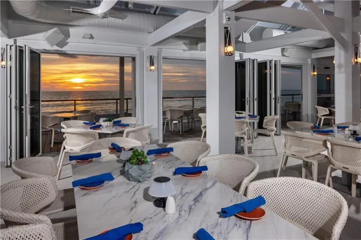 Sunset over the beach at 1 of 2 Pelican Bay Private restaurants