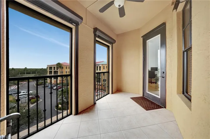 Balcony featuring ceiling fan