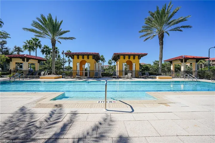 Community pool with a patio