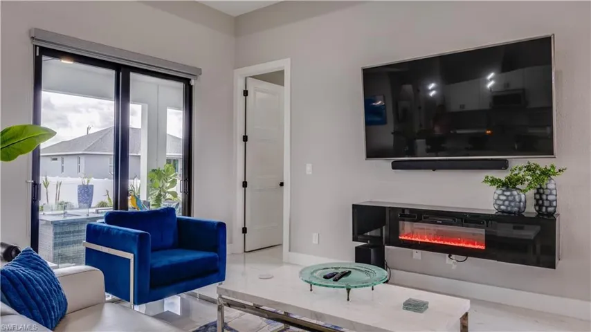Great room area with floating fireplace which conveys.