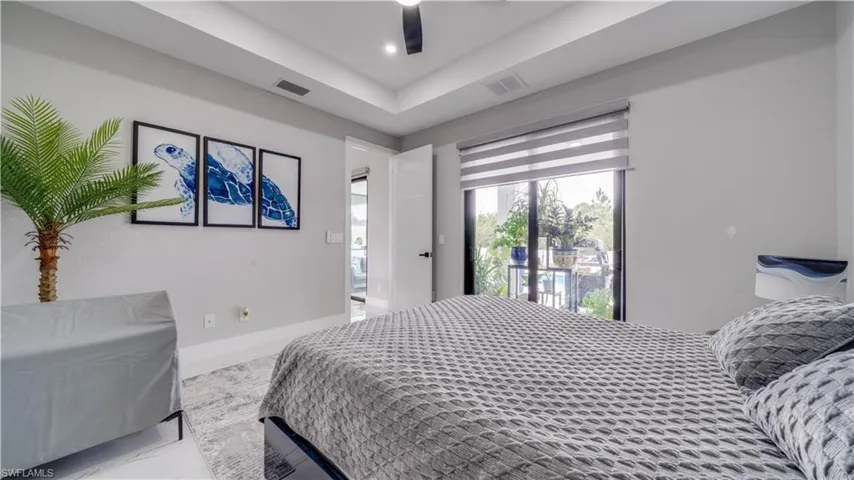 Primary Bedroom with access to pool/lanai