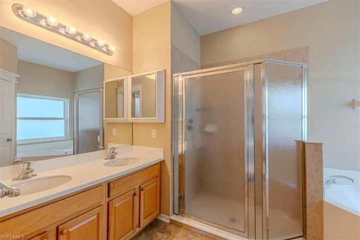 Primary Full Bathroom w/ Garden Tub, Walk-in Shower & Double Vanity.