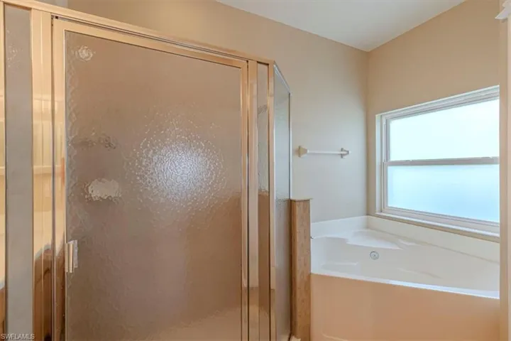2nd Full Bathroom w/ Garden Tub, Walk-in Shower & Double Vanity.