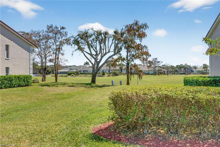 View of grassy yard featuring a residential view and golf course view