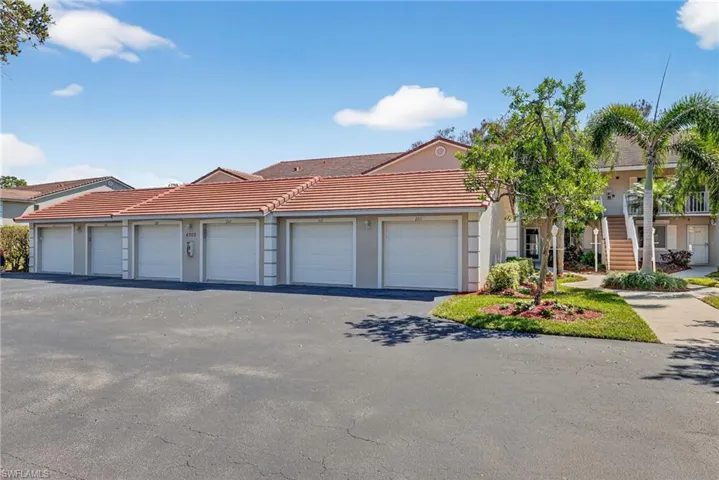 View of front of home with community garages and stucco siding