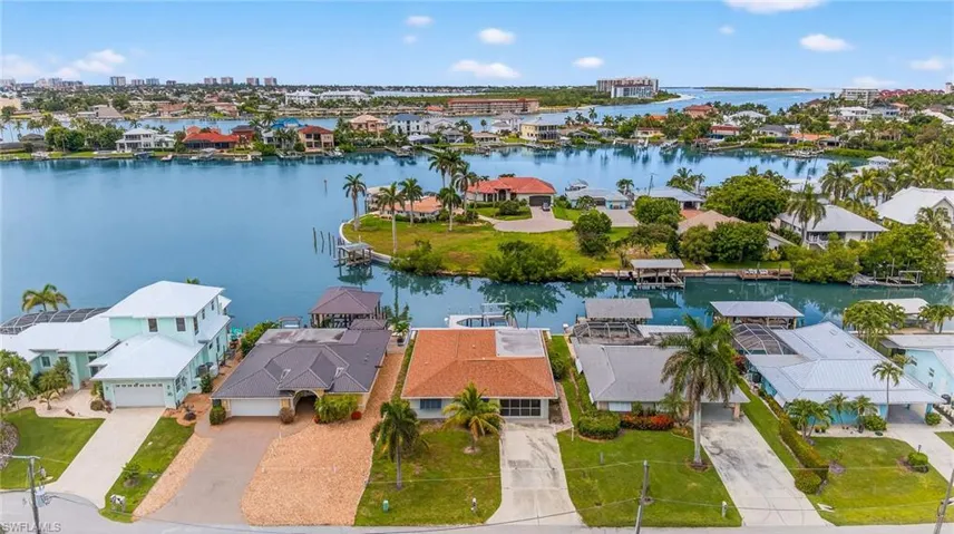 Aerial view of residential area with a nearby body of water