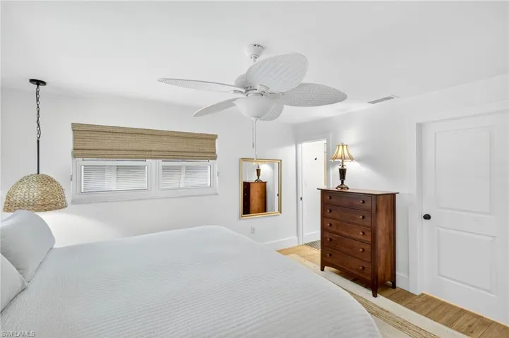 Bedroom with light wood-style flooring and ceiling fan