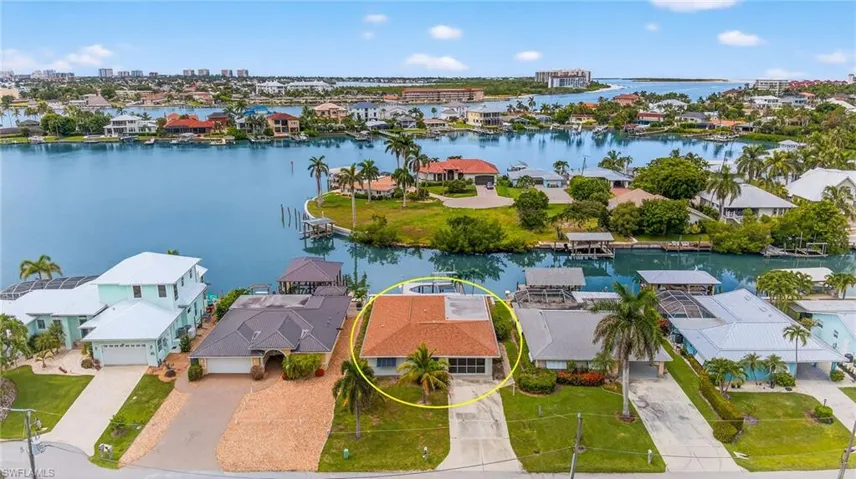 Aerial view of residential area with a nearby body of water