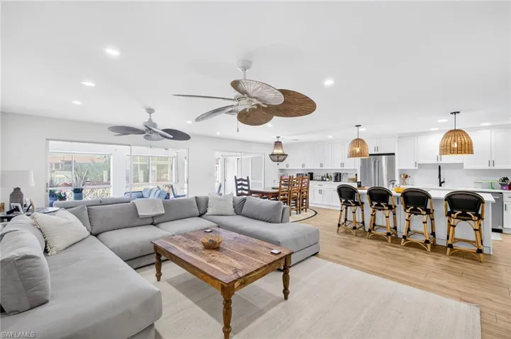 Living area featuring recessed lighting, light wood-style flooring, and ceiling fan