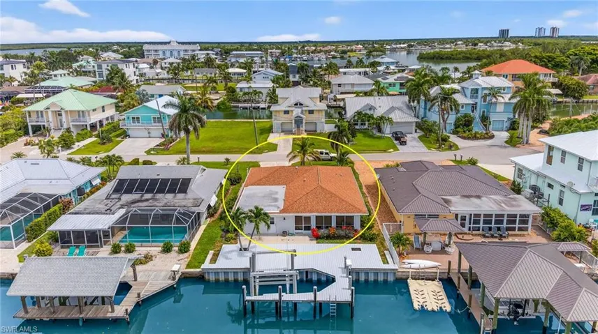 Aerial perspective of suburban area with a nearby body of water
