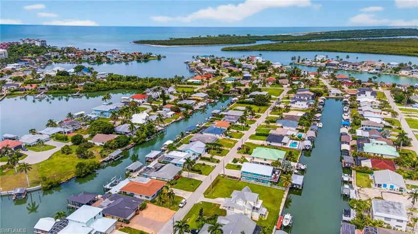 Aerial view of residential area featuring a large body of water