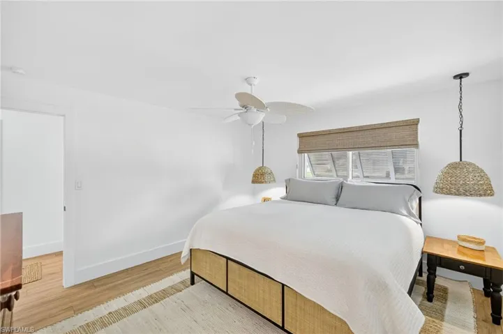 Bedroom featuring light wood-type flooring and ceiling fan