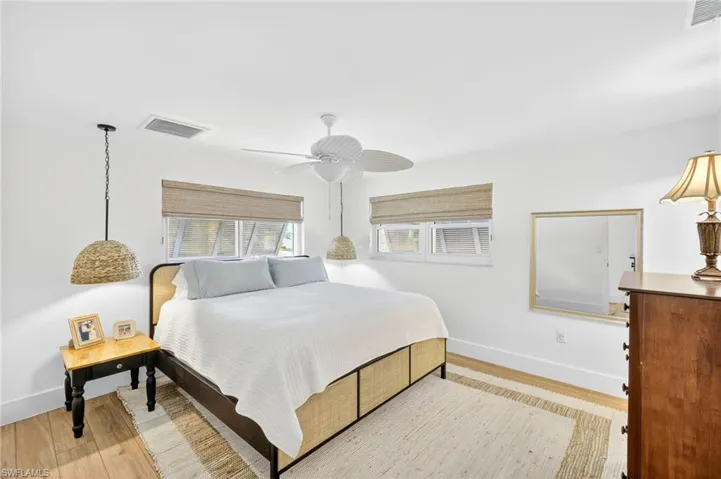 Bedroom featuring light wood-type flooring and ceiling fan