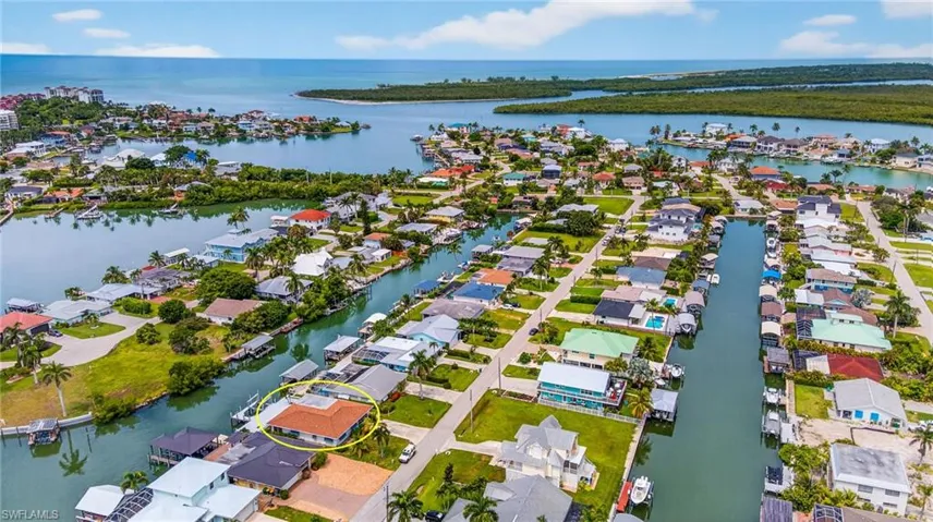 Aerial view of residential area with a large body of water