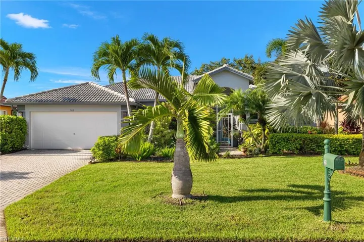View of front of home featuring a garage and a front yard.