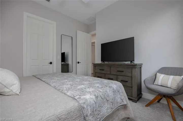 Neutral tone walls with white trim and carpeting