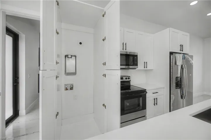 Integrated laundry closet with bi-fold doors