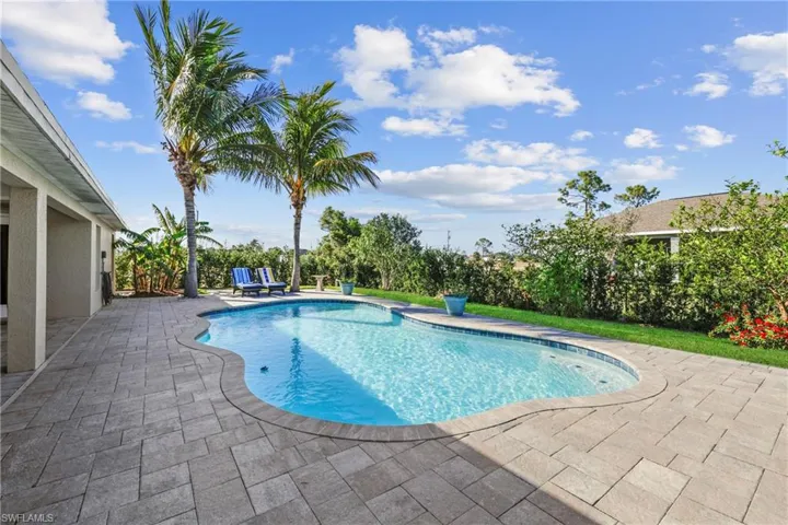 View of swimming pool with a patio area