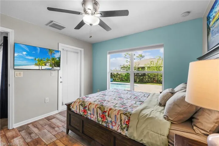 Bedroom with wood-type flooring and ceiling fan