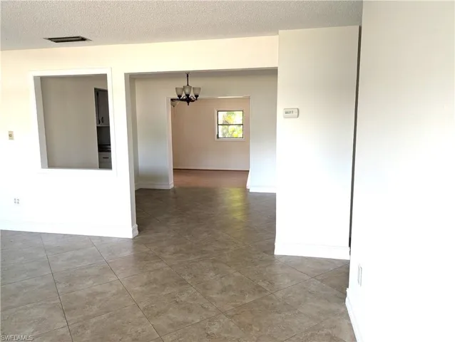 View from the living room through the dining room and into the family room