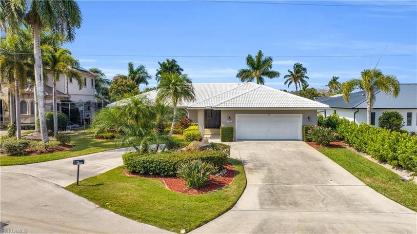 Circular driveway with beautiful landscaping.