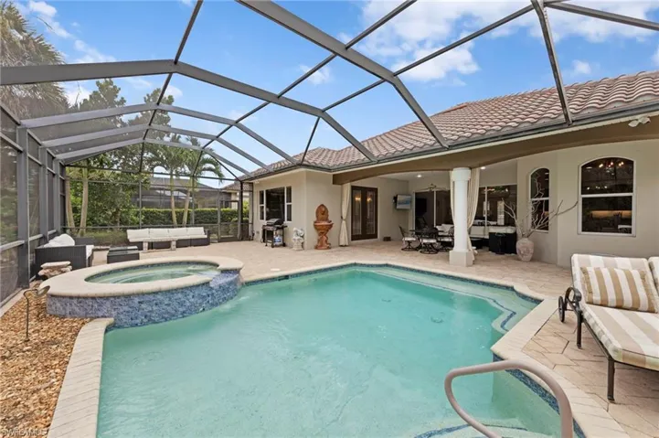View of pool featuring an outdoor hangout area, a patio area, and a sunroom