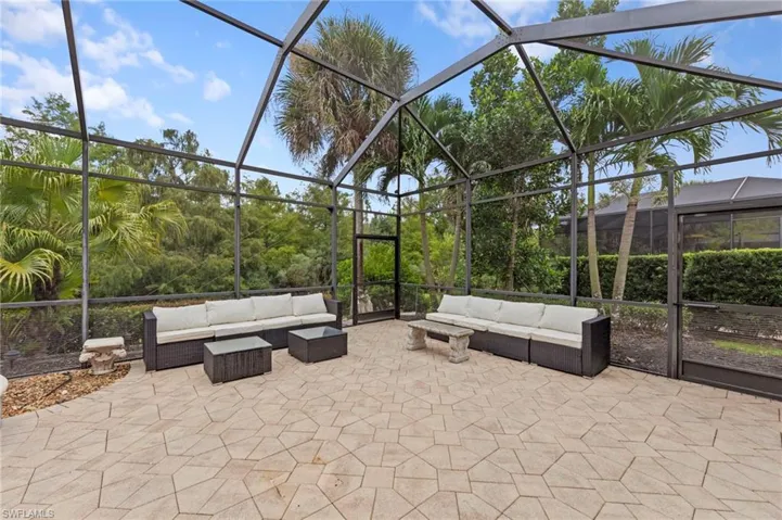 View of patio featuring a lanai and a sunroom
