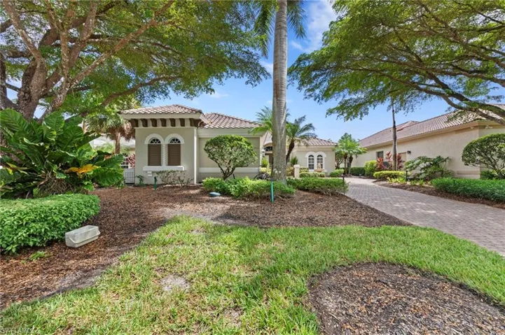 Mediterranean / spanish-style house featuring stucco siding and a tile roof