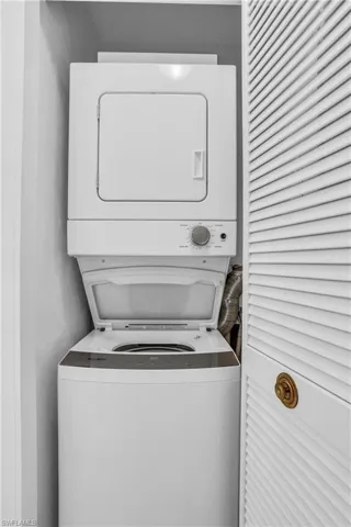 Washroom with stacked washer and dryer