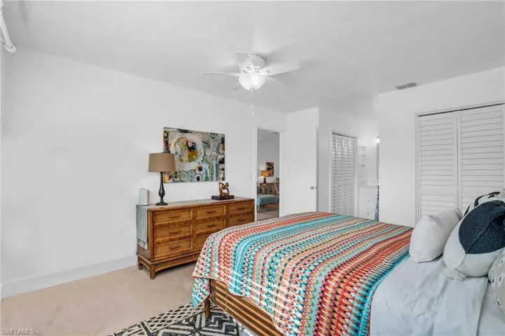 Tiled bedroom with ceiling fan