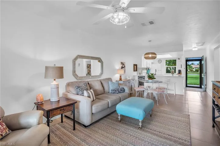 Tiled living room with ceiling fan