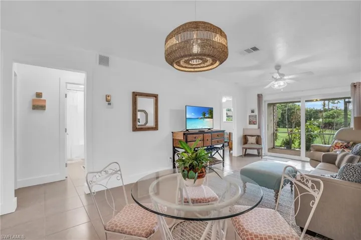 Dining room featuring ceiling fan and light tile floors