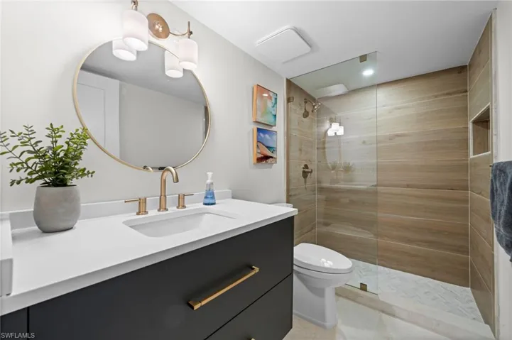 Bathroom with vanity and walk in shower
