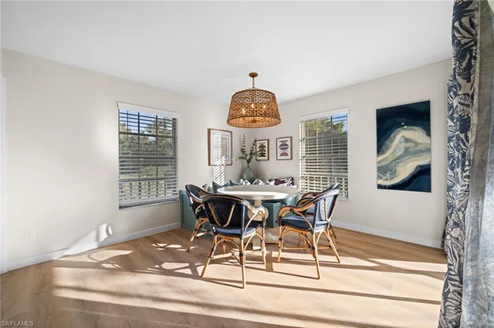 Dining space featuring light wood-style floors and baseboards