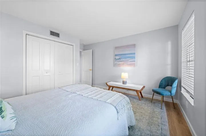Bedroom with a closet and wood finished floors