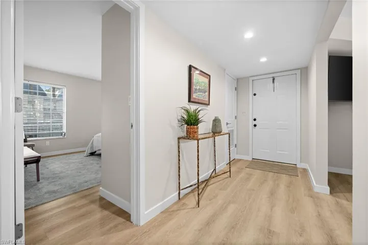 Foyer featuring light wood-type flooring and recessed lighting